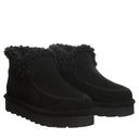BEARPAW Women's Maeve Platform Lo Boot in Black worn on foot with casual cold-weather styling for everyday wear.