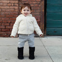 BEARPAW Toddler Elle Zipper Boot in Black worn in a cozy lifestyle setting, styled for everyday cold-weather kids' wear.