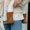 Close-up of BEARPAW Toddler Elle Zipper Boot in Hickory worn on foot with casual cold-weather styling for kids.
