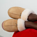 Model wearing BEARPAW Women's Retro Loki Slipper in Iced Coffee with relaxed casual styling for cozy everyday comfort.