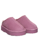 BEARPAW Women's Martis Clog in Rose Mauve worn on foot with casual styling, highlighting the easy slip-on silhouette for everyday wear.