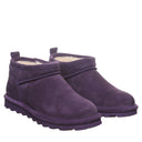 BEARPAW Women's Super Shorty Gothic Boot in Grape worn on foot with casual cold-weather styling for a distinctive everyday look.
