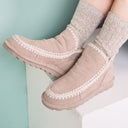Model wearing BEARPAW Women's Winter Boot in Mushroom with casual cold-weather styling for a cozy everyday winter look.