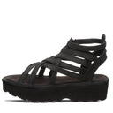 Bearpaw Women's Prominence Faux Leather Sandal in Black - side view