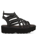 Bearpaw Women's Prominence Faux Leather Sandal in Black - angle view