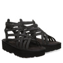Bearpaw Women's Prominence Faux Leather Sandal in Black - lifestyle on-foot