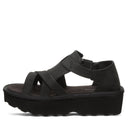Bearpaw Women's Pinnacle Faux Leather Sandal in Black - side view