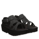 Bearpaw Women's Pinnacle Faux Leather Sandal in Black - lifestyle on-foot