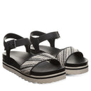 Bearpaw Women's Orion Faux Leather Sandal in Black and White - lifestyle on-foot