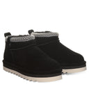 BEARPAW Women's Langly Boot in Black worn on foot with casual cold-weather styling for an everyday fall and winter look.