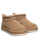 BEARPAW Women's Langly Boot in Toffee worn on foot with casual cold-weather styling for an everyday fall and winter look.