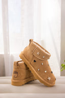 Model wearing BEARPAW Women's Shorty Boot in Nova Iced Coffee with casual fall styling for a cozy everyday look.