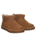 BEARPAW Women's Akira Boot in Hickory worn on foot with casual cold-weather styling, showing the boot in an everyday fall and winter look.