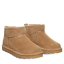BEARPAW Women's Akira Boot in Iced Coffee worn on foot with casual cold-weather styling for an everyday fall and winter look.