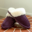 Model wearing BEARPAW Women's Loki II Slipper in Larkspur with relaxed casual styling for cozy everyday comfort.