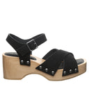 Side view of Bearpaw Colette sandal black with wood-look platform heel, suede straps and secure ankle buckle