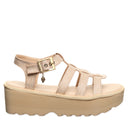 Side view of Bearpaw Delilah natural raffia sandal with adjustable ankle strap and platform