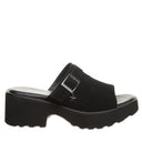 Side profile of the BEARPAW Frances Sandal in Black showing the 2.2-inch heel and the soft cow suede upper treated with BearCoat®.