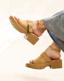 Bearpaw Frances sandal in toffee featuring a platform sole, soft upper, and adjustable strap, shown on foot with a casual denim look.