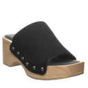Bearpaw Tilda sandal in black suede angle view featuring wooden platform heel, wide upper strap with stud details and open toe design