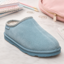 BEARPAW women’s Tourmaline Blue suede clog styled with notebooks, pencils, paper clips, and a pink backpack for back to school.